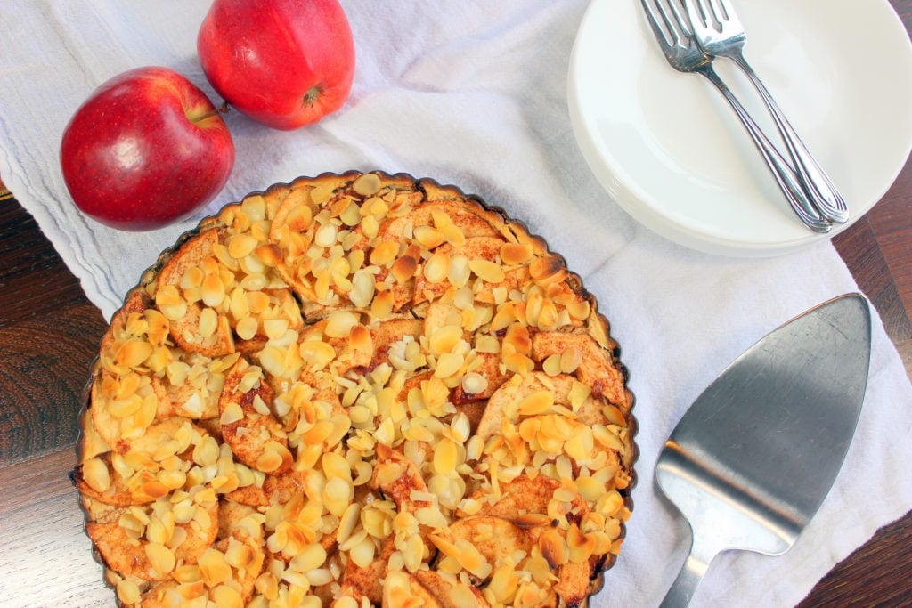Baked cream cheese apple pie topped with slivered almonds.
