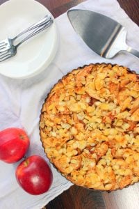 Apple Pie topped with Sliced Almonds in Tart Pan.