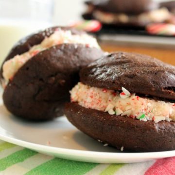 Chocolate cookies filled with vanilla icing and crushed candy canes.
