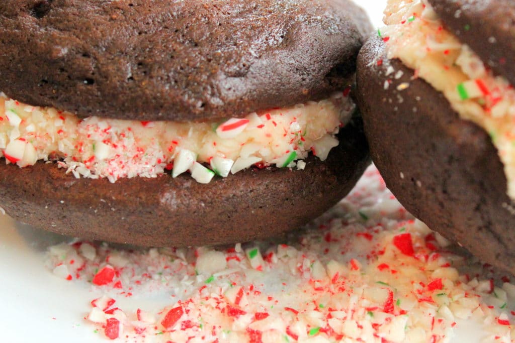 Chocolate Christmas cookies filled with crushed candy cane and vanilla Icing.