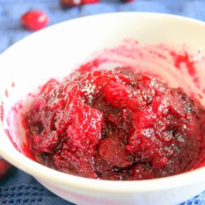Cranberry sauce in white bowl.