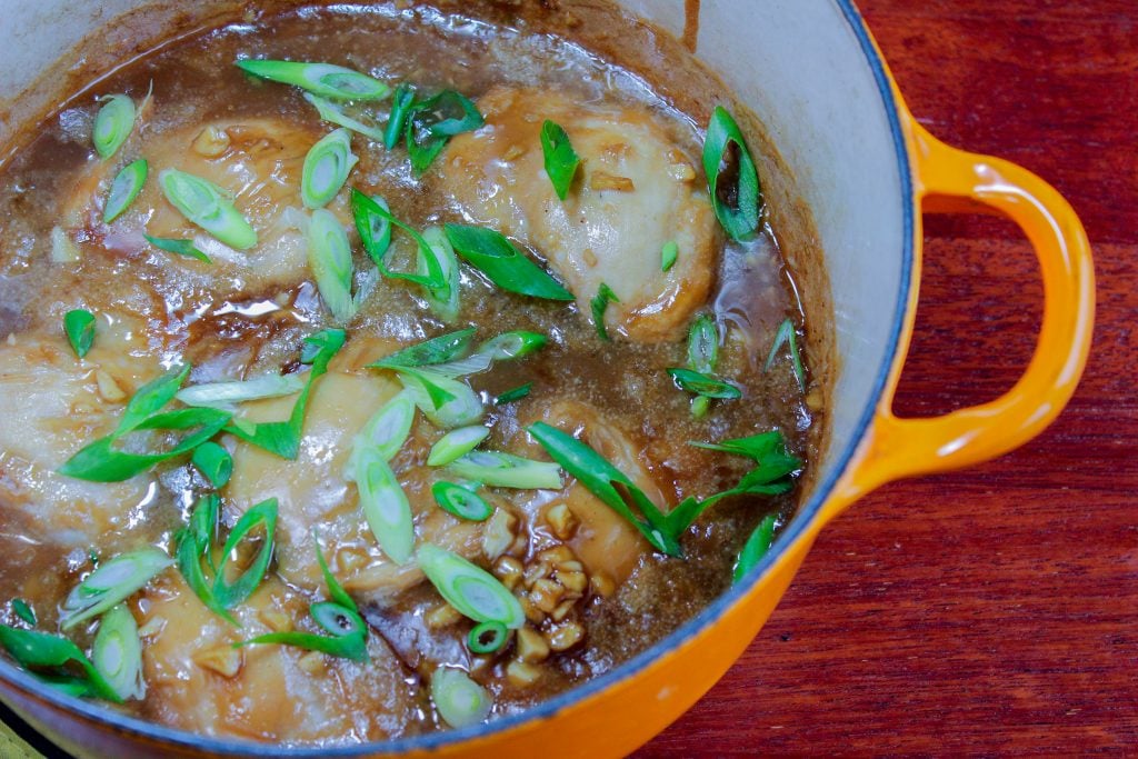 Brown Sugar Chicken topped with Chopped Green Onion in Yellow Pot.