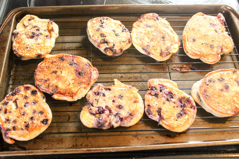 Healthy Blueberry Pancakes cooling on wire rack on sheet pan.