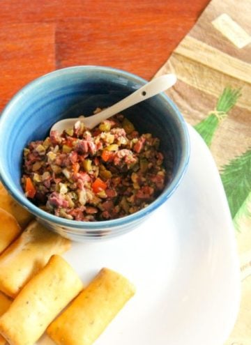 Olive tapenade in small blue bowl.