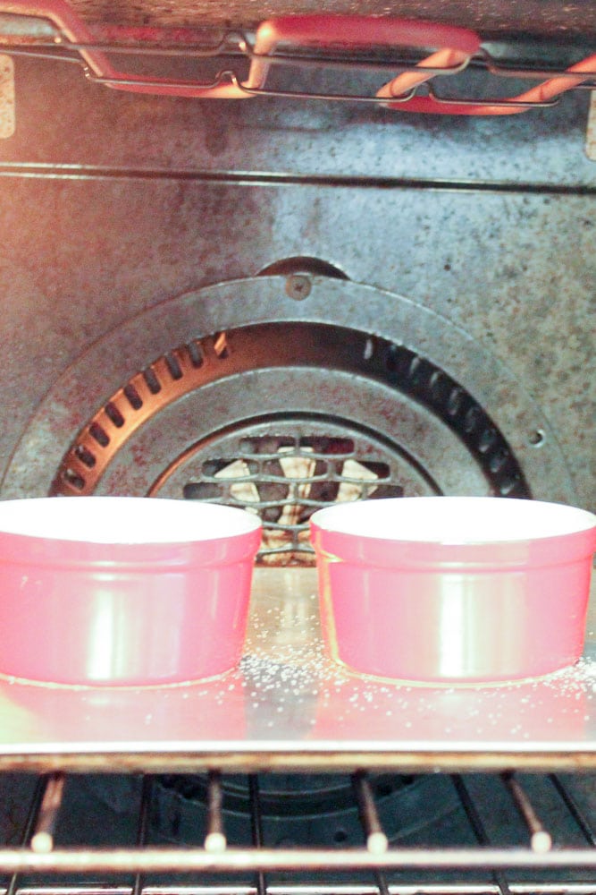 Creme Brûlée in Red Ramekins in Oven.