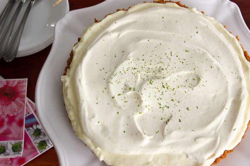 Key Lime Pie topped with Lime Zest in white plate.