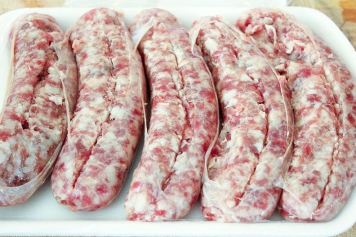 Raw Sausages in white package.