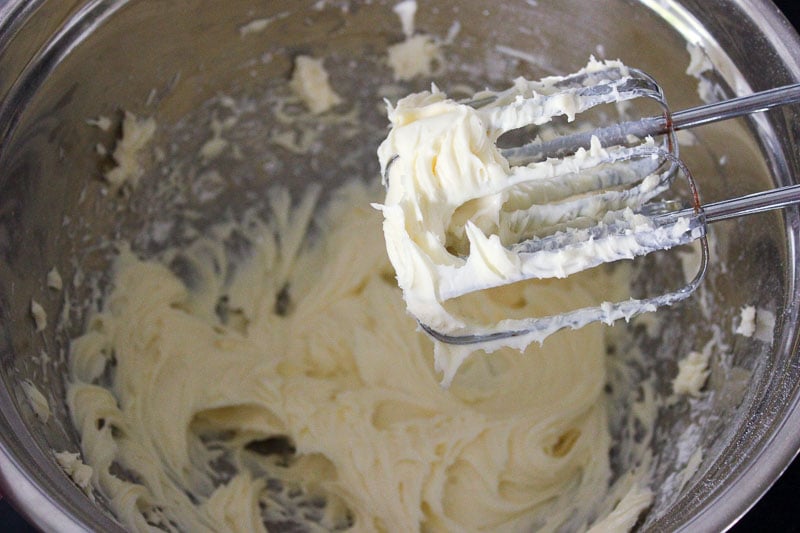 Cream Cheese Mixed in metal mixing bowl.
