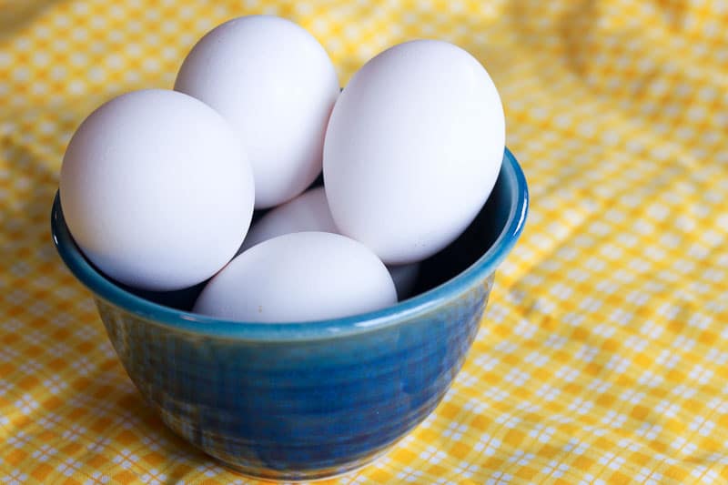 White Eggs in Blue Bowl.