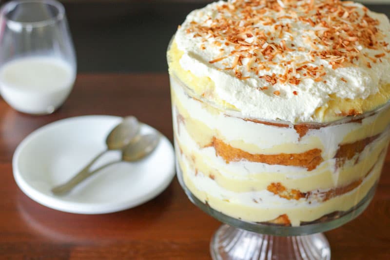 Coconut Cream Trifle topped with Whipping Cream and Toasted Shredded Coconut.