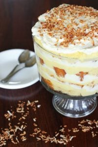 Coconut Cream Trifle topped with Whipping Cream and Toasted Shredded Coconut.