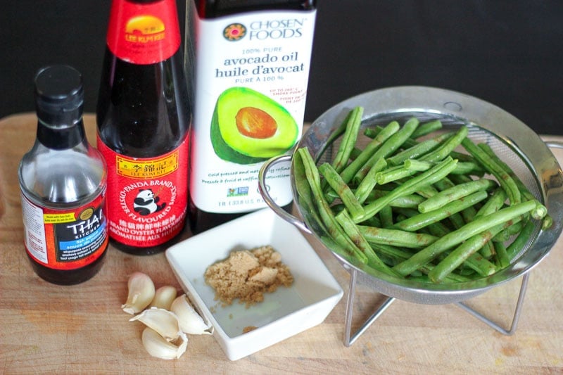 Asian-Style Green Bean Ingredients on Wooden Board.