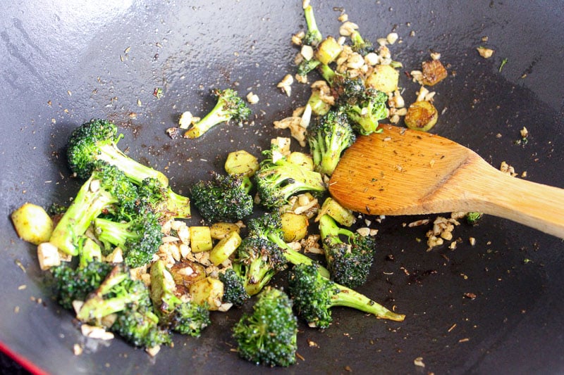 Broccoli and spices Mixed together in wok.