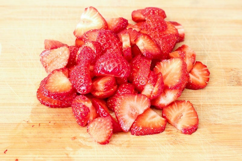 Sliced Strawberries on Wooden Board.