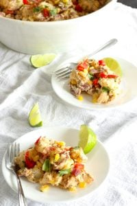 Healthy Southwest Potato Salad in a serving dish with small servings on plates