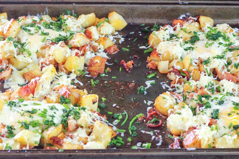 Potato, Bacon and Egg topped with Cheese and Parsley on Sheet Pan.