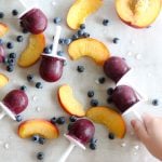 These Blueberry Peach Popsicles celebrate the fresh fruit of late summer in a deliciously sweet and simple blend. Just 3 ingredients (or 4 if you use honey) and ready for the mold in minutes, they're a simple treat that my toddler (and I!) can't get enough of!