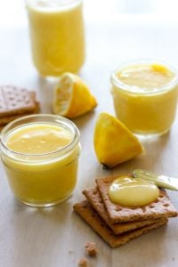 Small glass jars filled with lemon curd.