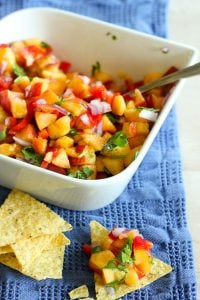 Fresh and Easy Peach Salsa in serving dish, served with tortilla chips