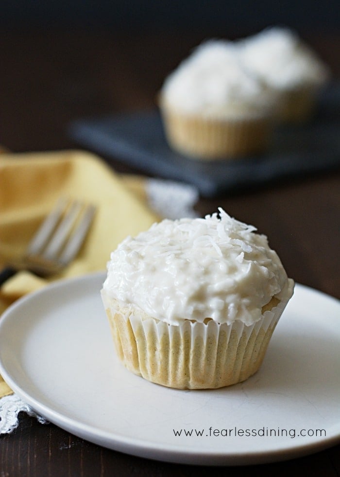 Cupcake topped with Lemon and Coconut Frosting.