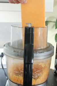 Block of Cheddar Cheese In Food Processor.