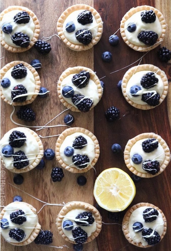 Lemon Cream Tarts topped with blackberries and blueberries.
