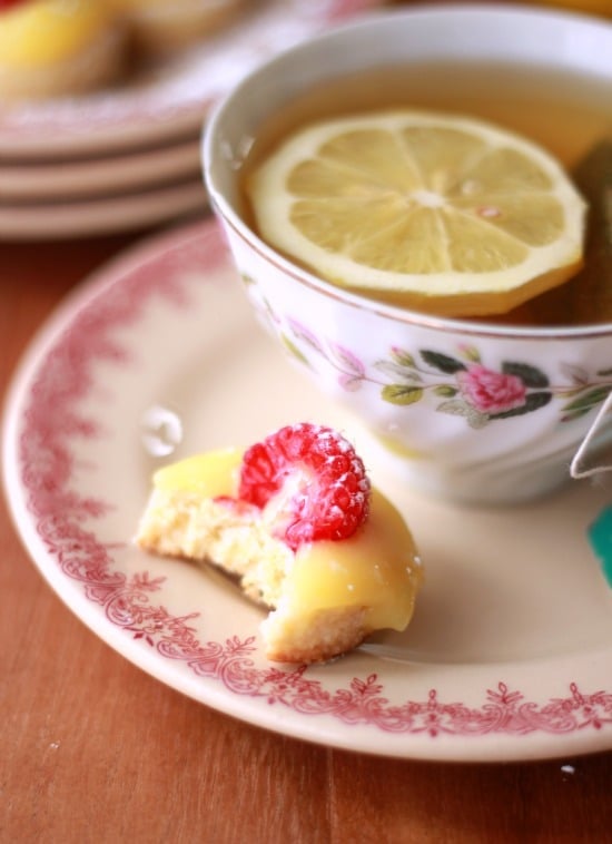 Lemon Curd and Raspberry Tea Biscuits on White and Pink Plate.