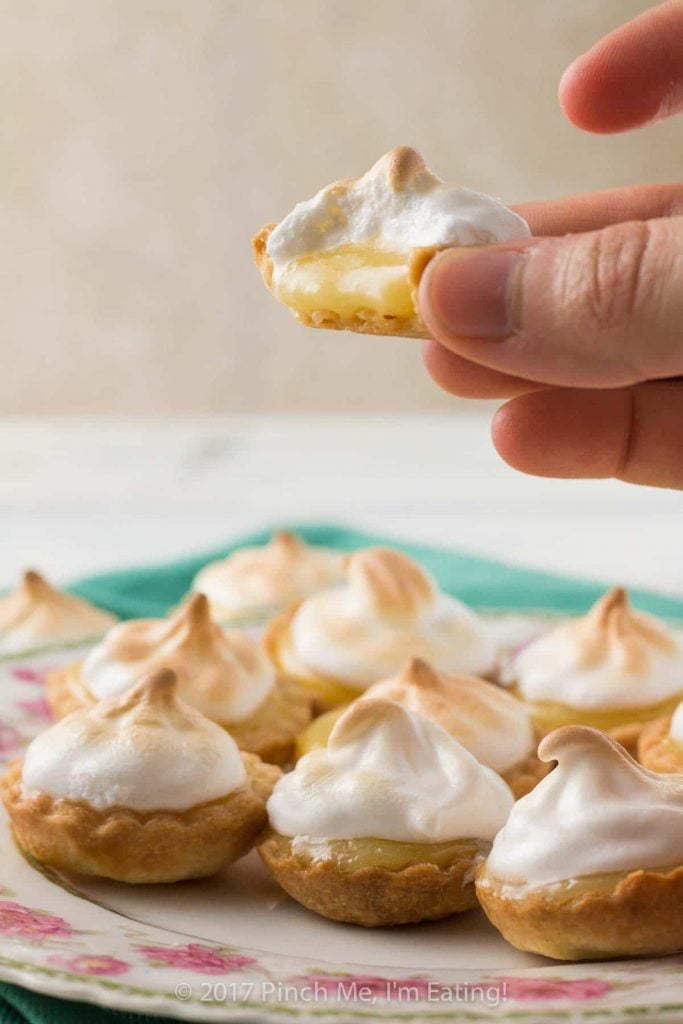 Mini Lemon Meringue Pies on White Plate.