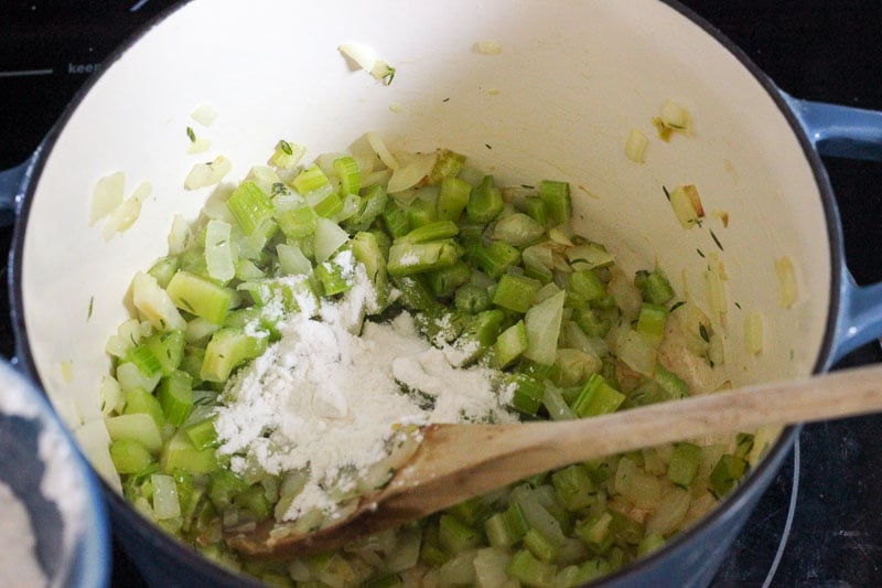 Chopped Celery and Flour in Blue Pot.