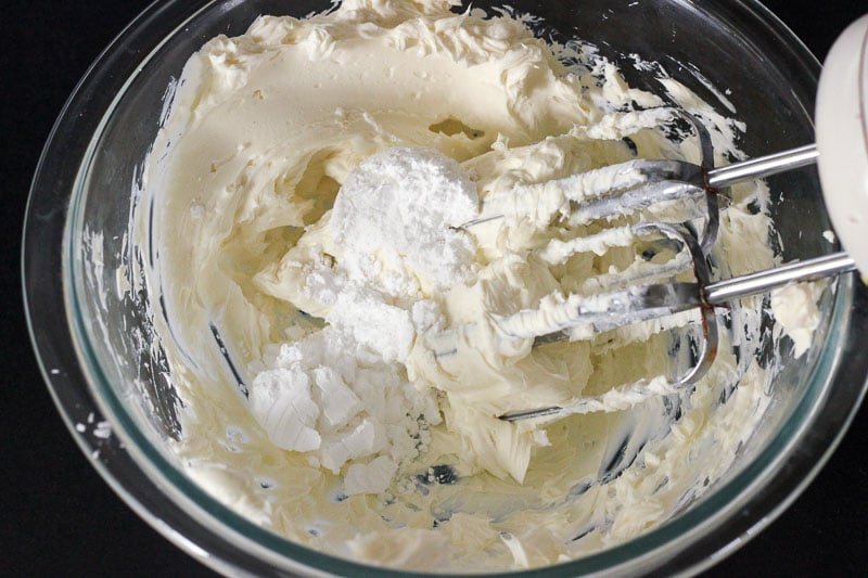 Mixing Cream Cheese and Icing Sugar in Glass Bowl.