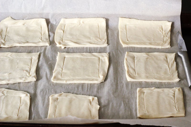 Nine Puff Pastry Rectangles on Parchment Paper.