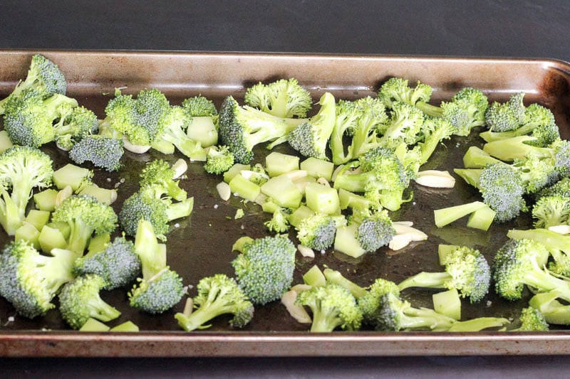 Chopped Broccoli and Garlic on Baking Sheet.