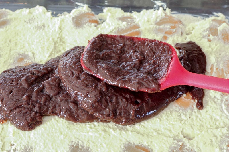 Spreading Chocolate Pudding Over vanilla cream cheese layer.