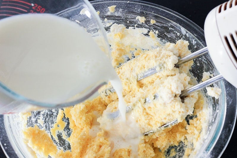 Adding Milk to vanilla pudding and cream cheese mixture.