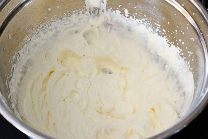 Whipped Cream in Metal Mixing Bowl.