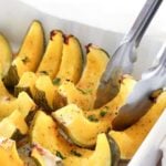 Sliced baked squash in white dish.