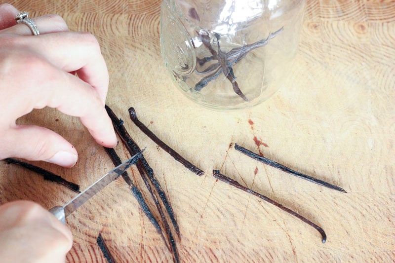 Slicing Vanilla Beans on Wooden Board.