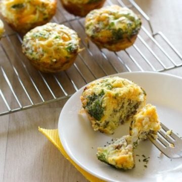 Sausage and egg muffin on white plate.