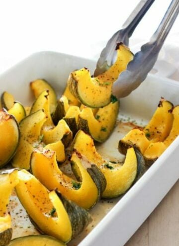 Sliced baked squash in white dish.