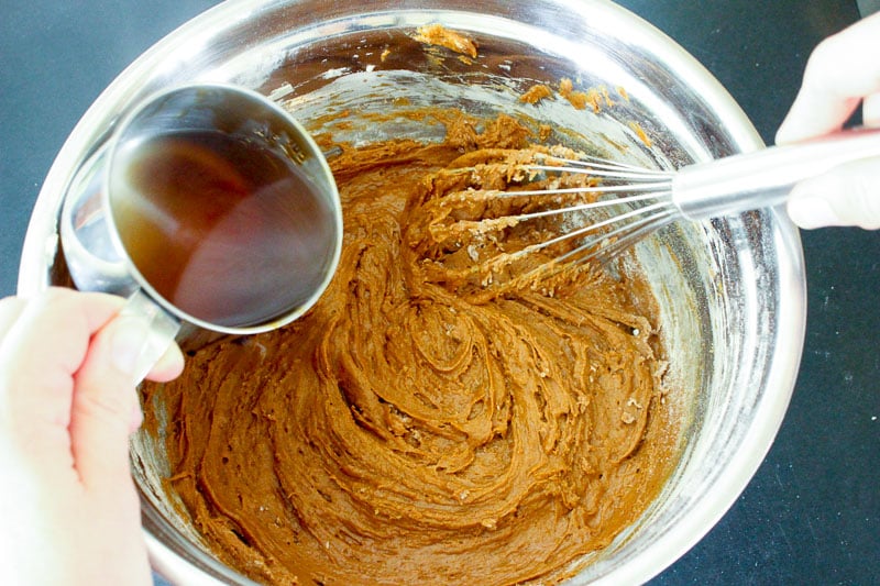 Adding Water to Gingerbread Cake Batter in Metal Bowl.