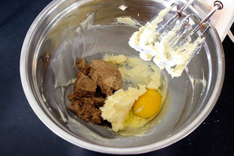 Creaming butter, eggs and brown sugar in Metal Bowl.