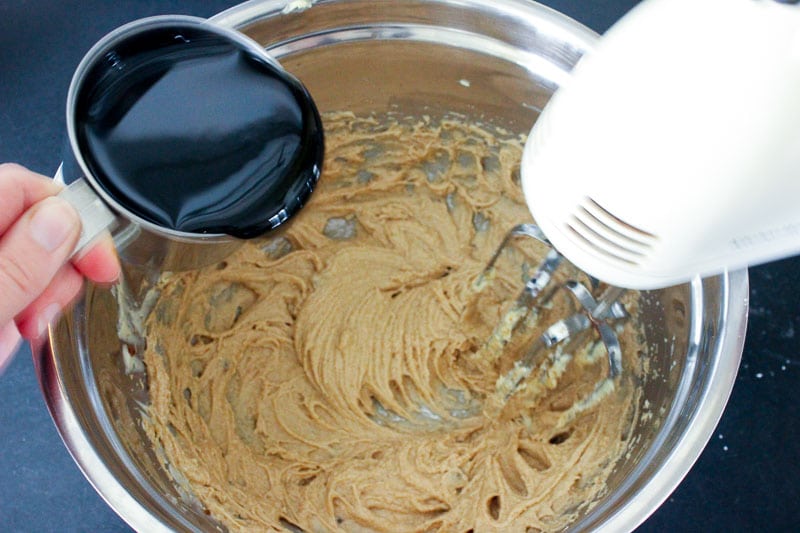 Adding Molasses to Brown Sugar and Butter Mixture in Metal Bowl.