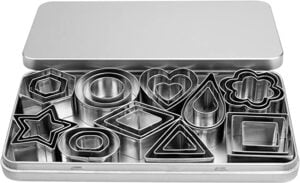 Metal cookie cutters in different shapes in a metal rectangular box.