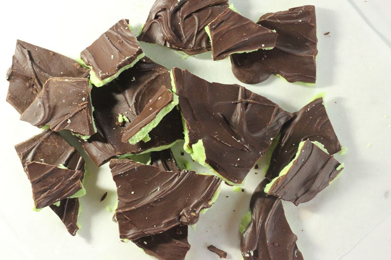 Pieces of Mint Chocolate Bark Spread on Parchment Paper.