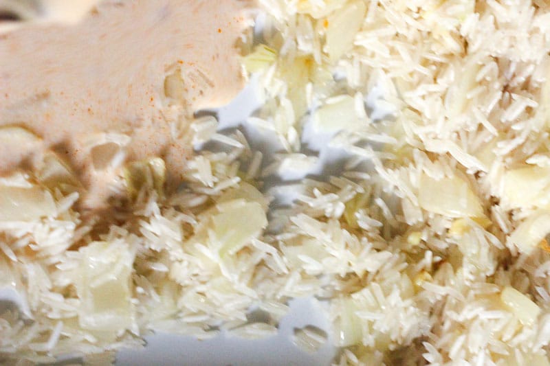 Rice and Sauce added to cooked onion mixture.