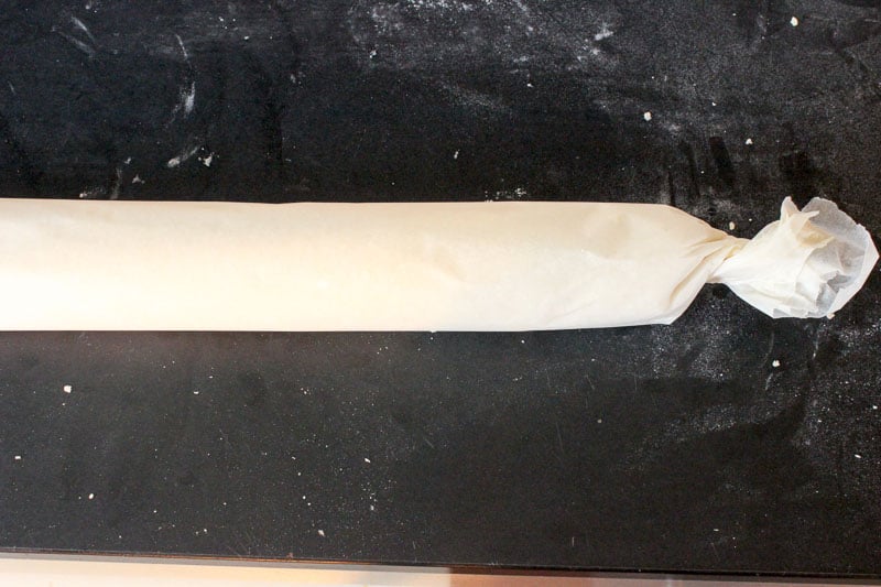 Eggnog Cookie Dough Rolled in Parchment Paper.