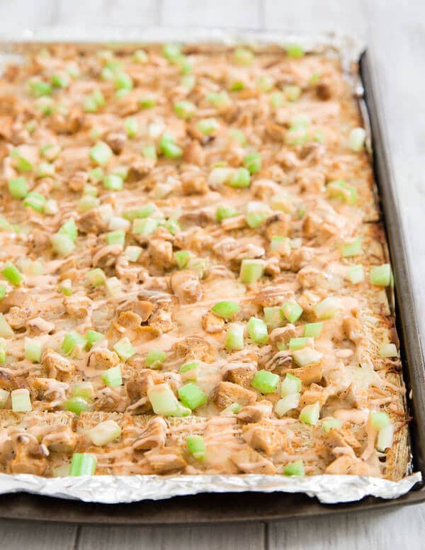 Triscuit Crackers topped with Chicken, Celery and Brown Sauce in Sheet Pan.