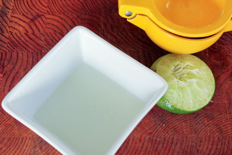 Lime juice in small square bowl.