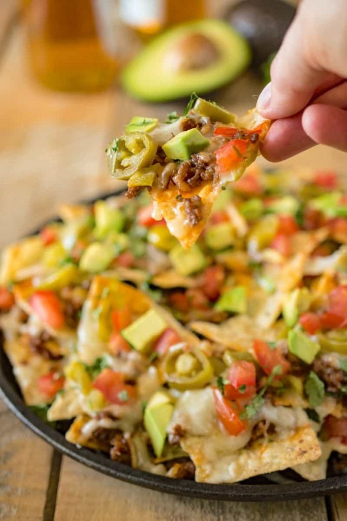 Nacho Chips topped with Jalapeños, Ground Beef Avocado and Tomatoes.