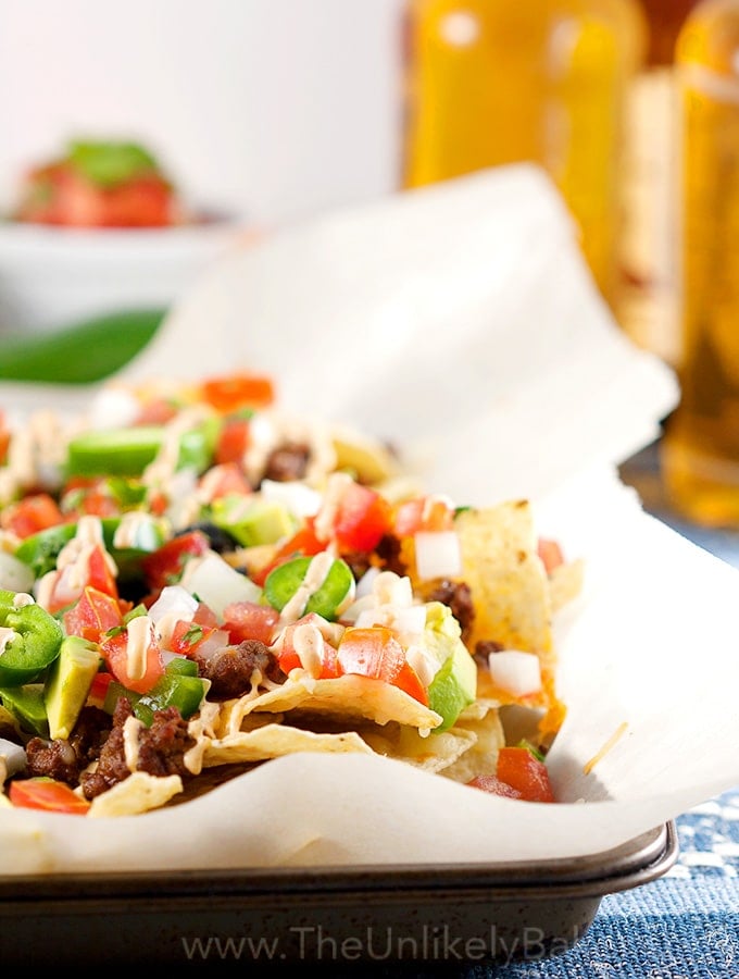 Nacho Chips topped with Tomatoes, Jalapeños, Avocado and Ground Beef.